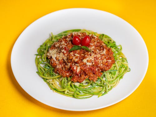 Zucchini Noodles with Bolognese Sauce on White Plate