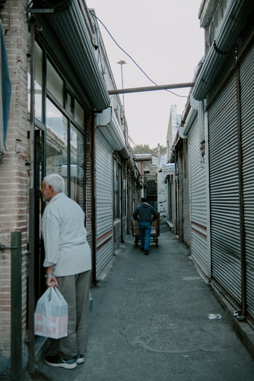 Gratis stockfoto met boodschappen doen, gozers, markt