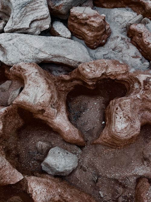 Free Textured close-up of a natural rock formation displaying intricate patterns. Stock Photo