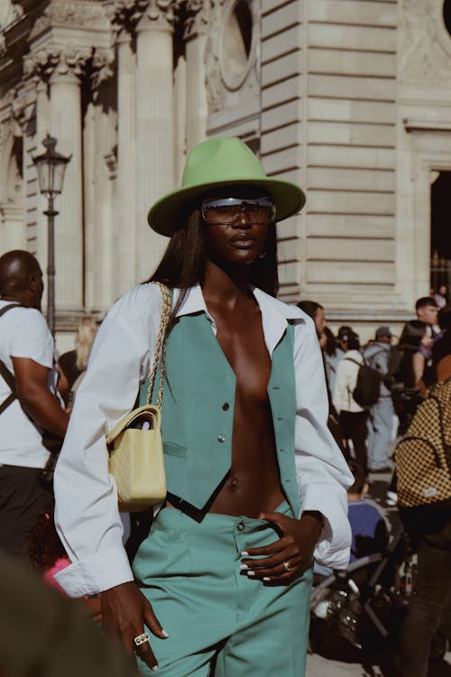 Photograph of a Woman Wearing a Green Hat