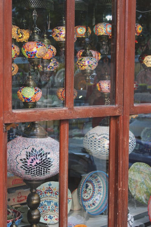 Free Variety of Mosaic Lamps Displayed on Store Window Stock Photo