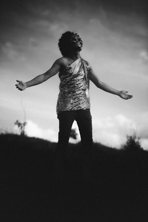 Man in Costume on Hill in Nature