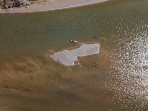 Aerial View of a Sandy Island on the Sea
