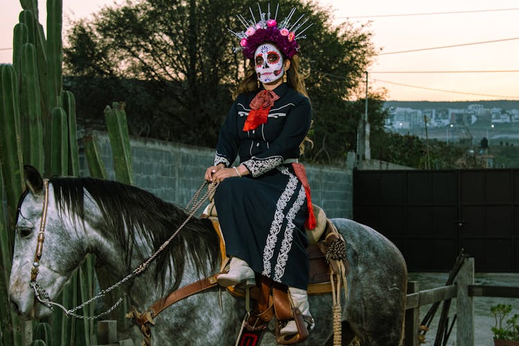 Woman In Costume Sitting A Horse