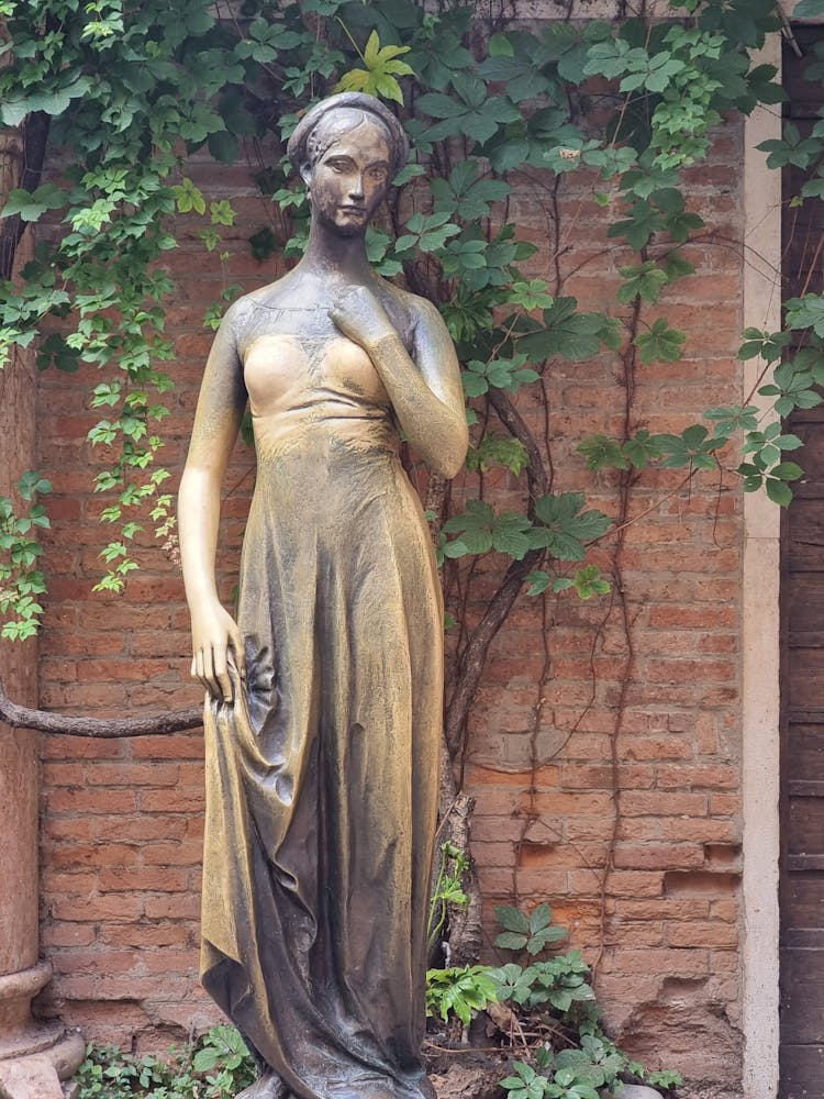 Woman In Brown Dress Statue