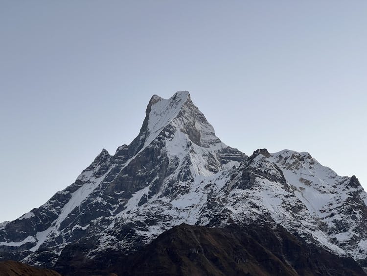 The Peak Of Mount Machapuchare In Nepal