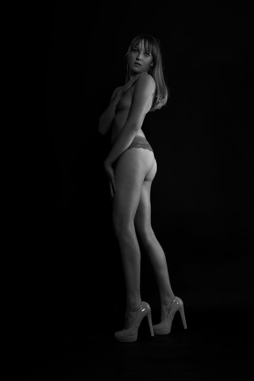 Grayscale Photo of a Topless Woman