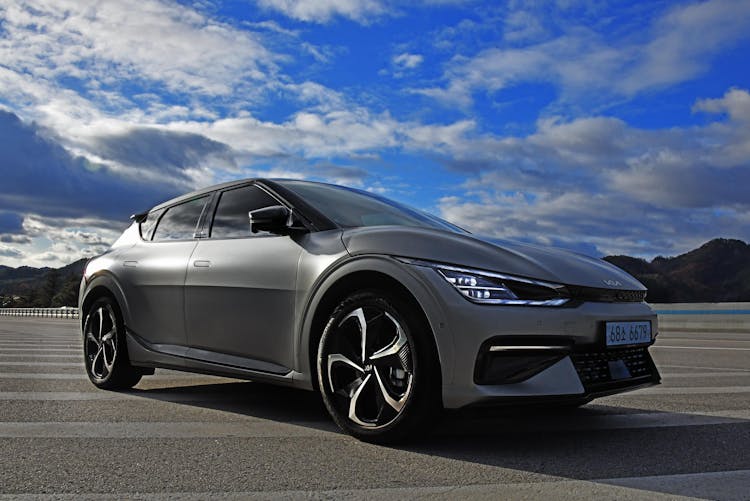 Photo Of A Car Under A Cloudy Sky