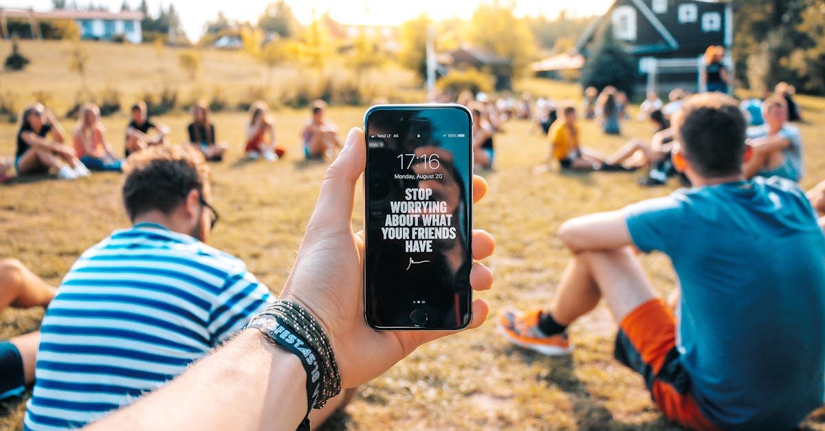 Photo of Person Holding Black Iphone