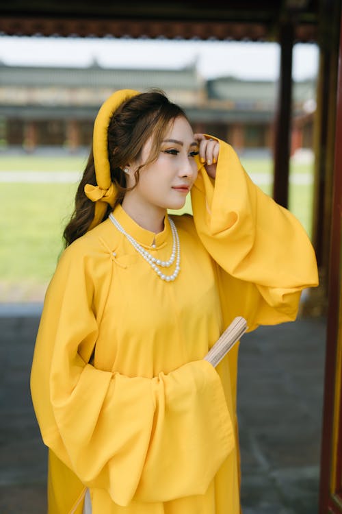 A Woman in Yellow Traditional Wear