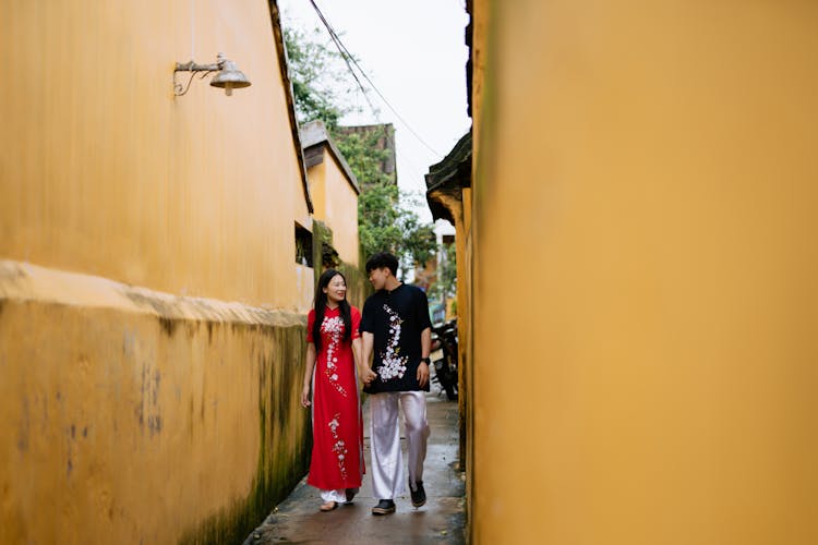 Young Couple Walking Narrow Street