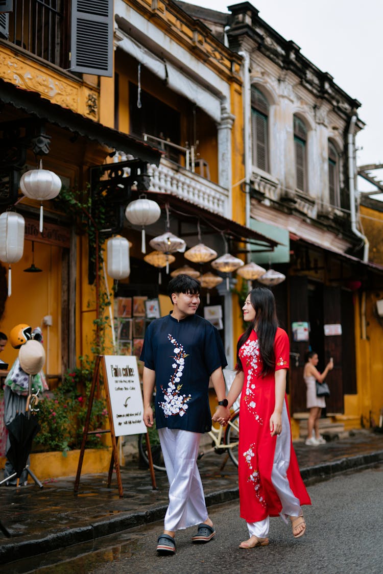 A Couple Walking Near Buildings