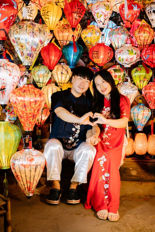Photo of a Young Couple Surrounded by Traditional Vietnamese Lanterns