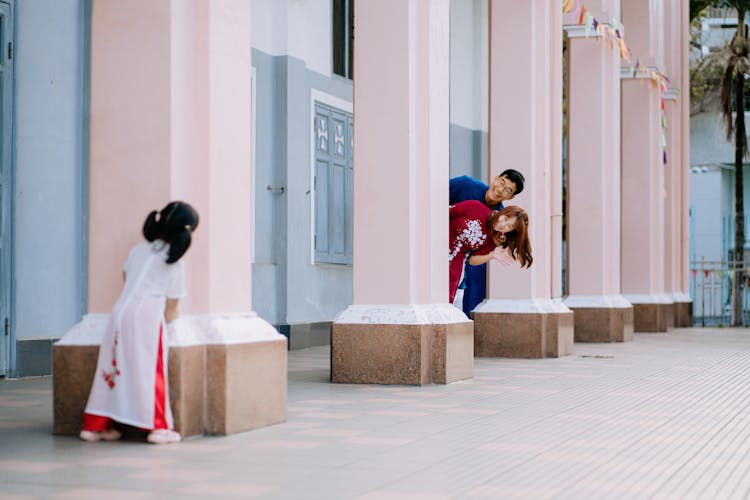 A Family Having Fun Playing Hide And Seek