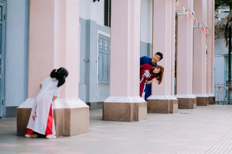 A Family Having Fun Playing Hide And Seek