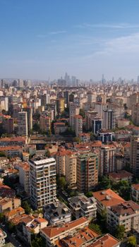 Aerial view of Istanbul's cityscape with skyscrapers and vibrant urban architecture under a clear blue sky.