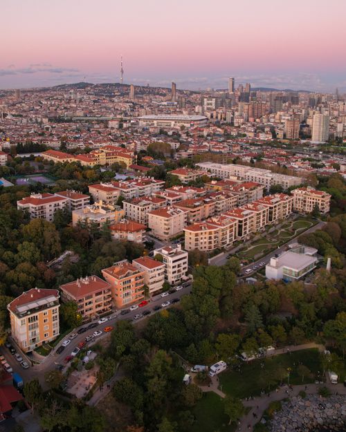 Free Stunning aerial view of a vibrant cityscape with diverse architecture at sunset. Stock Photo