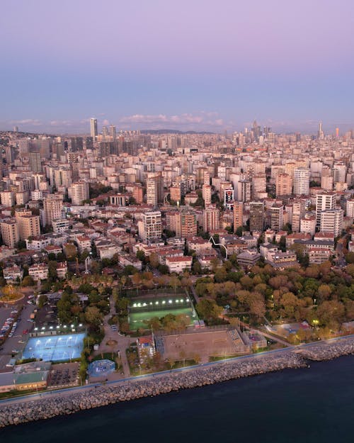 Playing Courts and City Buildings Near a Body of Water