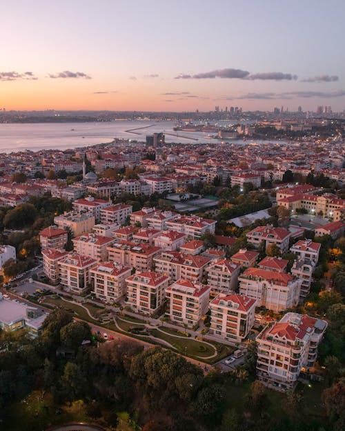 Aerial View of City Buildings with Red Roofs
