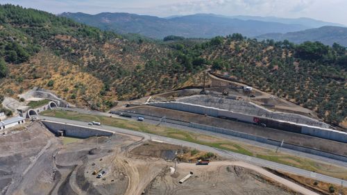 Free Aerial view of road construction in Küçükçetmi, Çanakkale, Turkey amidst the scenic hills. Stock Photo