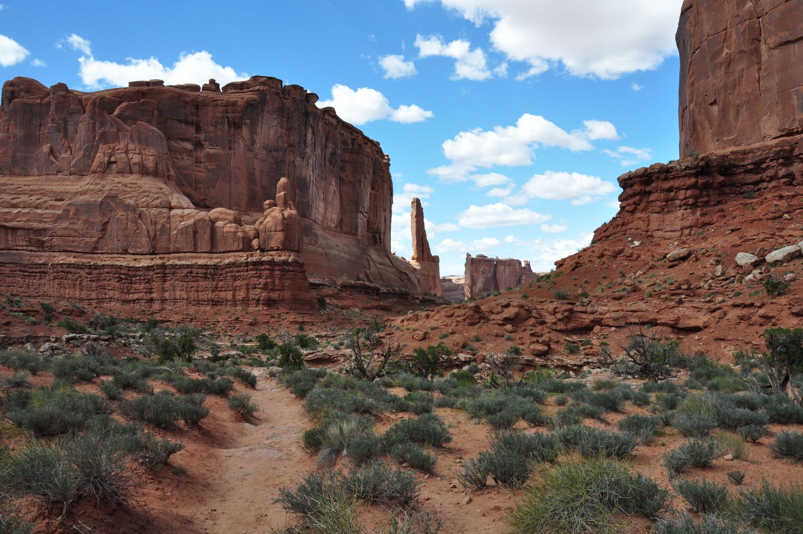 Red rock desert canyon off-road trail with towering sandstone cliffs