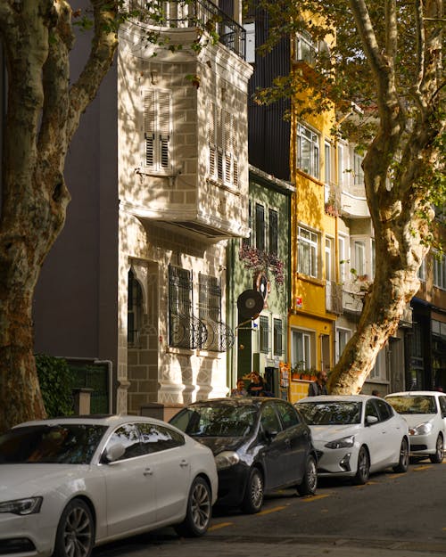 Cars Parked on Side of Road Near Building