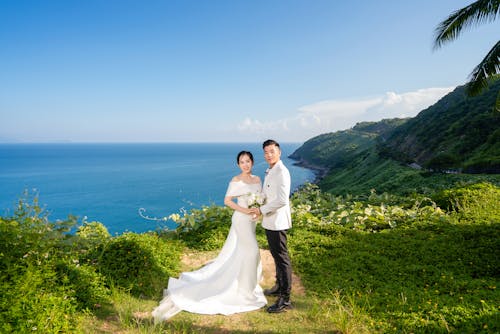 Beautiful Couple Standing on Mountain Top