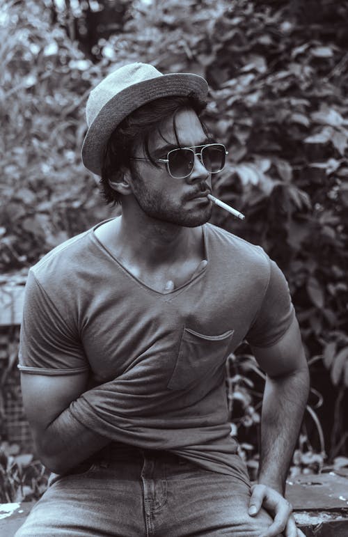 Monochrome Photo of a Man Smoking a Cigarette