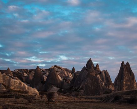 Landscape with Rock Formations and Blue Sky with Clouds
