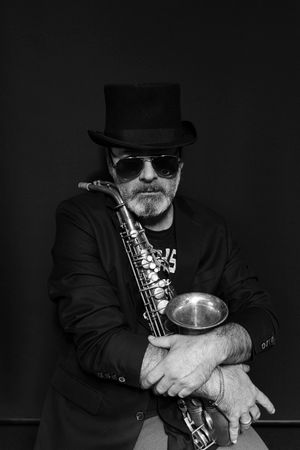 Portrait of a saxophonist in a bowler hat, cover of the Nov. 4 issue — photograph by Francesco Altamura on Pexels