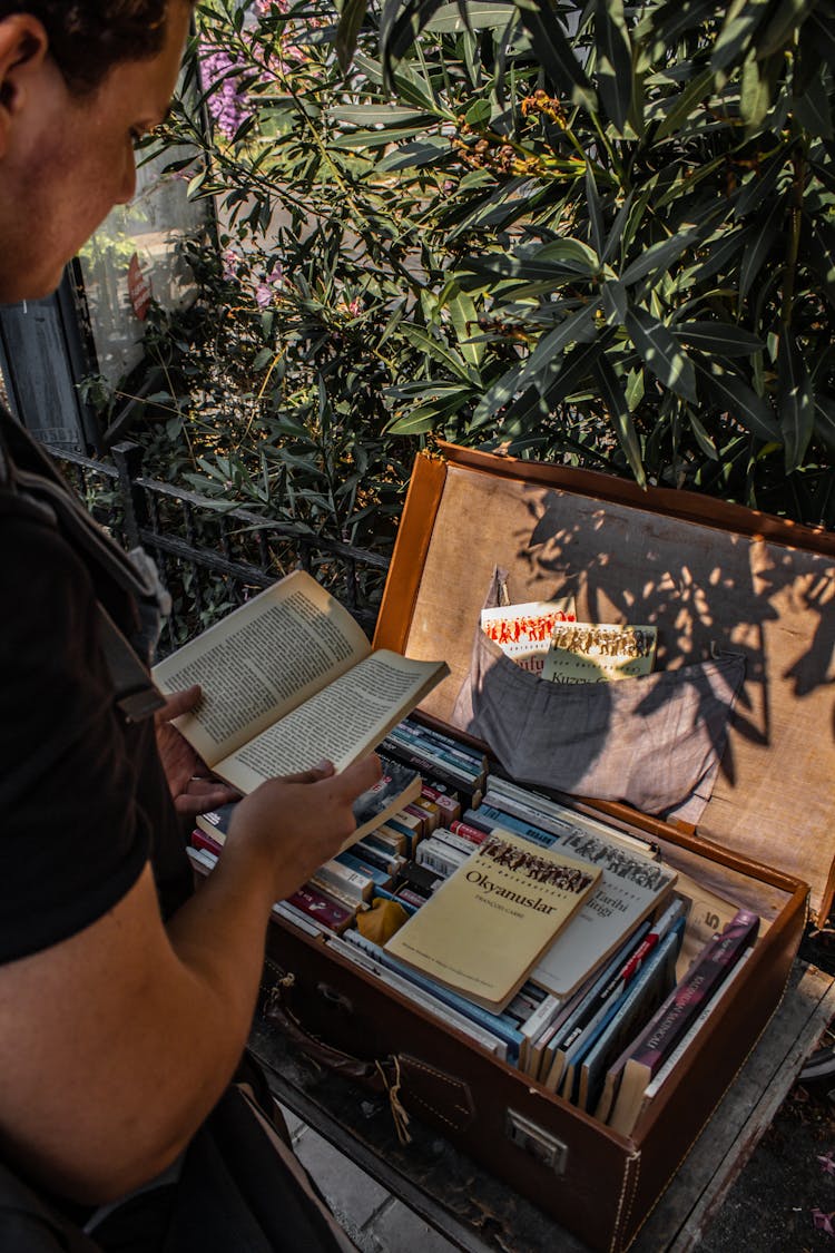 A Person Reading A Book