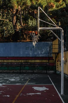 A rustic basketball hoop and court with graffiti in Heybeliada, Istanbul, Turkey.