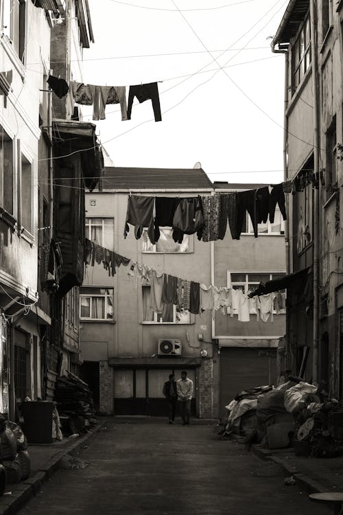 Laundry Hanging on Clotheslines between Houses on a Narrow Street