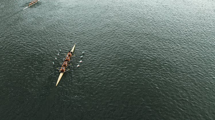 Straight Four Boats Racing On A River