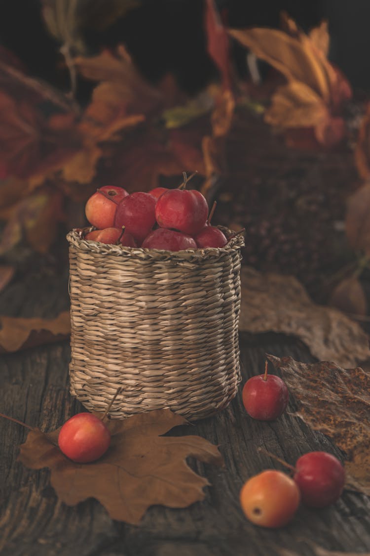 A Red Apples On A Woven Basket