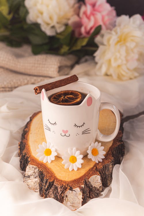 Beverage in Decorated Cup on Wooden Tray