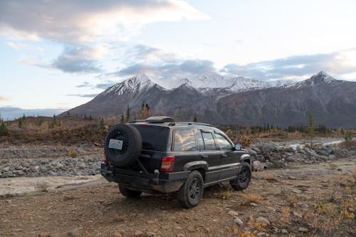 Black SUV on Dirt Road