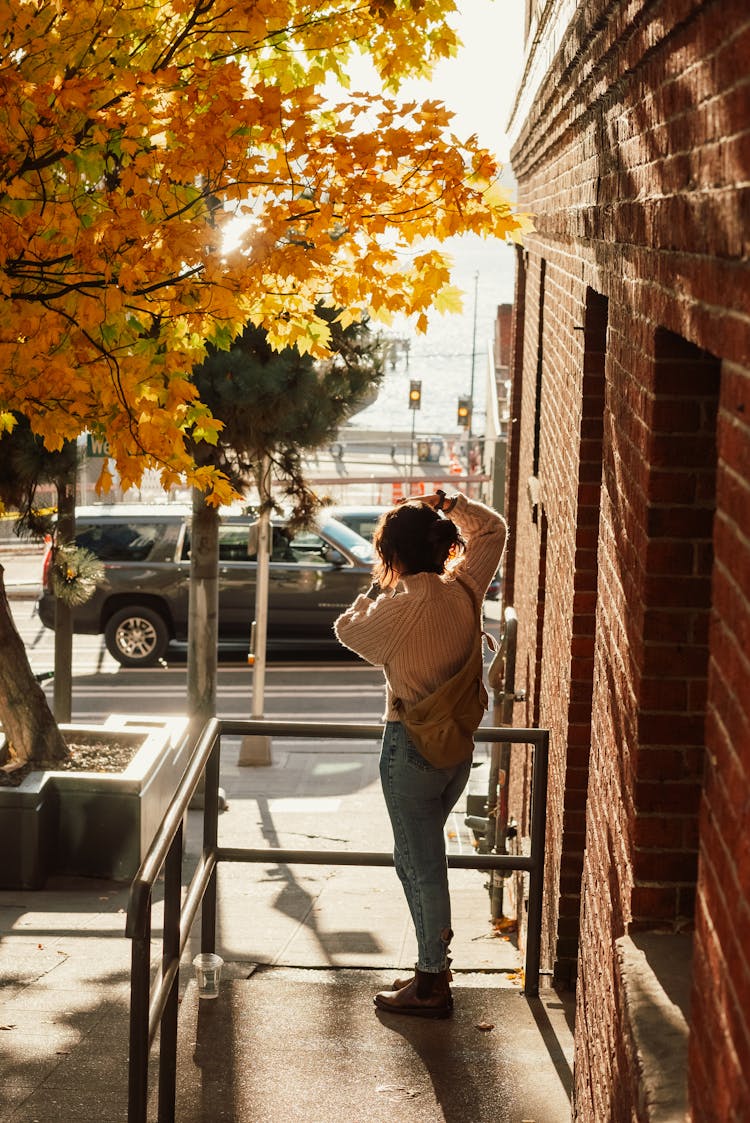 Back View Of A Person Standing On A Porch