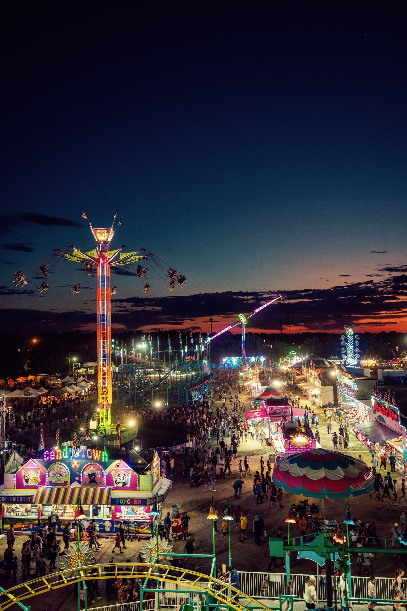 Aerial view of the Western Fair midway lit up at night in London, Ontario