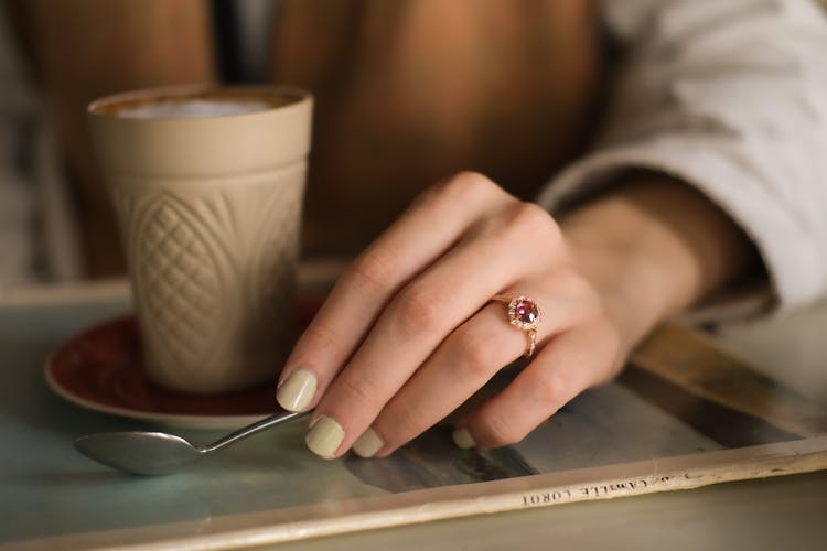 A Person With A Ruby Ring