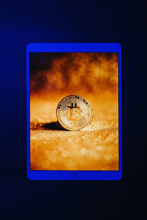 Bitcoin Screensaver in an iPad · Free Stock Photo