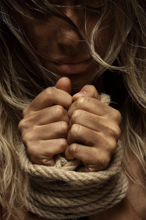 Close-Up Photo of Woman With Her Hands Tied With Rope