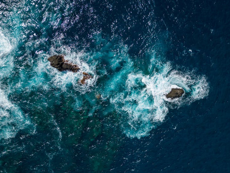 Drone Shot Of Rock Formations In An Ocean