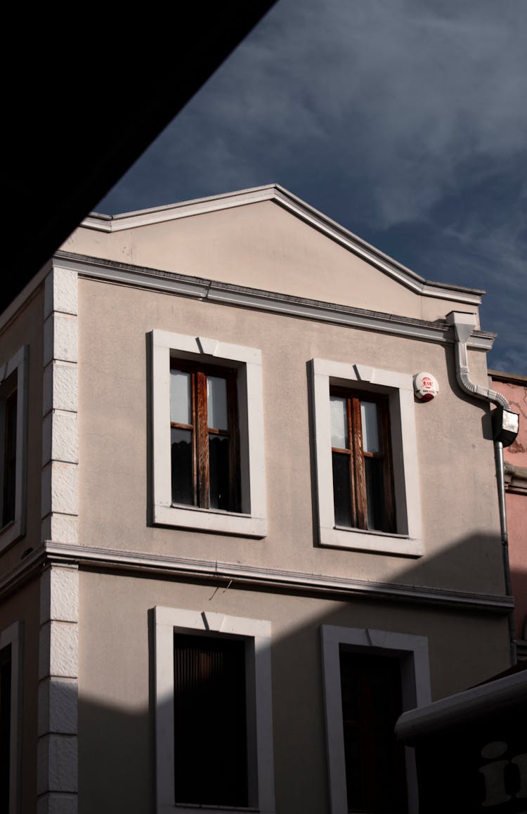 A Gray Building With Windows