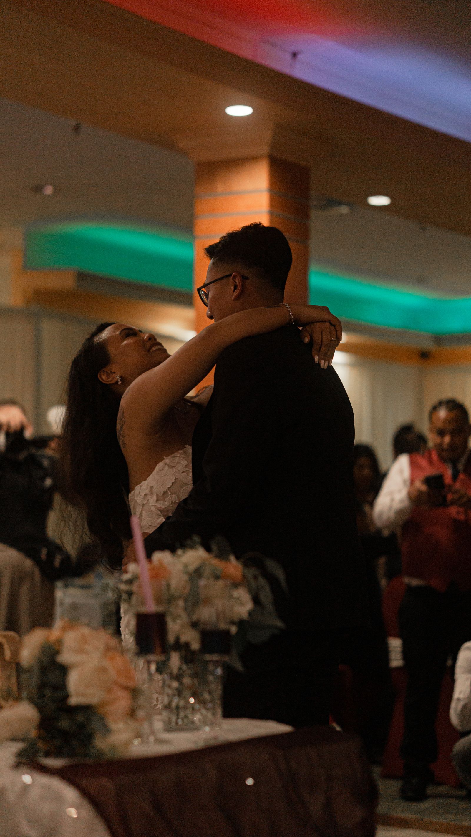 Couple dancing at indoor wedding reception