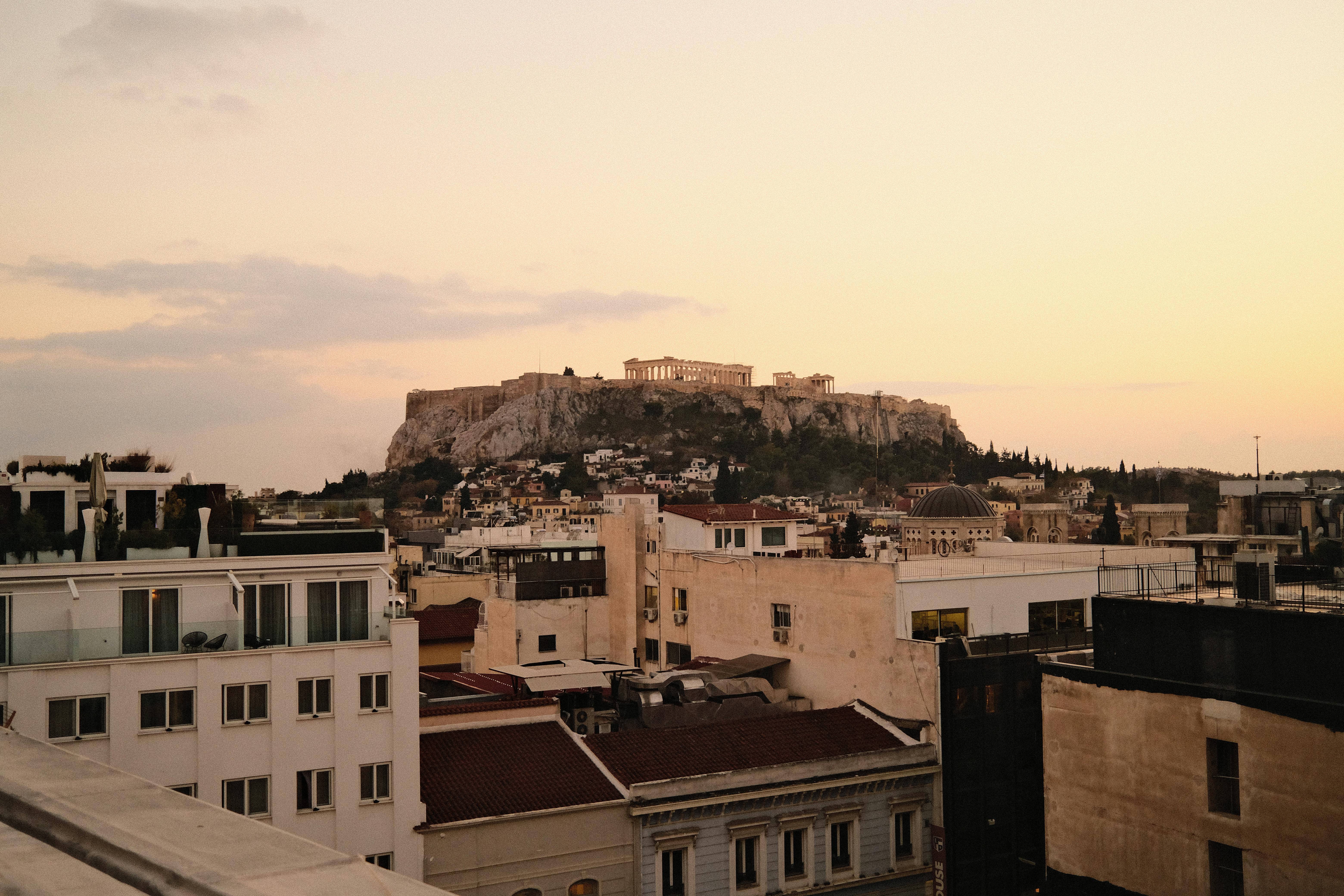 Athens Instagram spots photography - sunset view of the Acropolis from a rooftop with pastel sky