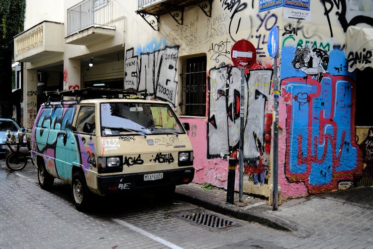 Photograph Of A Van With Graffiti