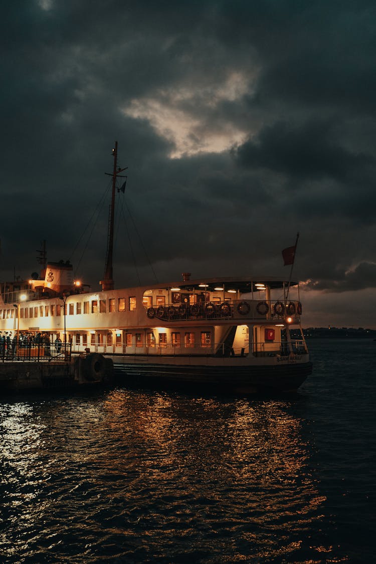 Illuminated Passenger Boat At Dawn 