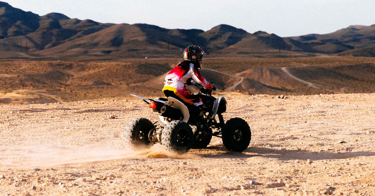 Person Riding a Quad Bike in the Desert · Free Stock Photo