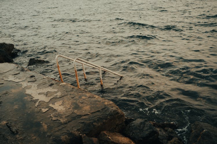 Stairs Railing Disappearing Into Sea